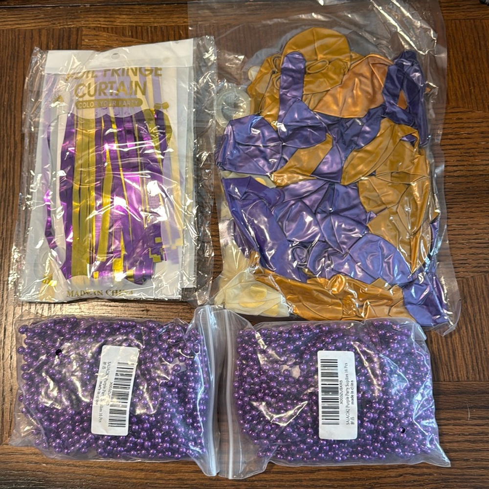 New in packages! Purple and gold decor.